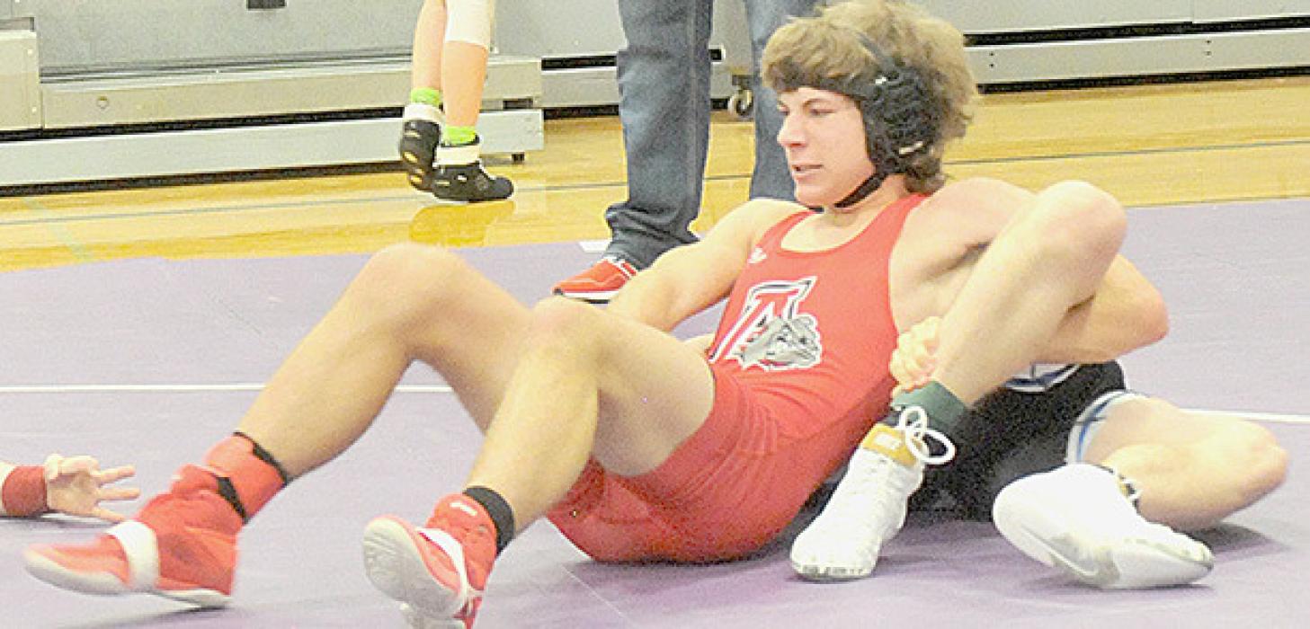 Nacona Shurter pickups up three points on his opponent in the 157 lb. weight class.