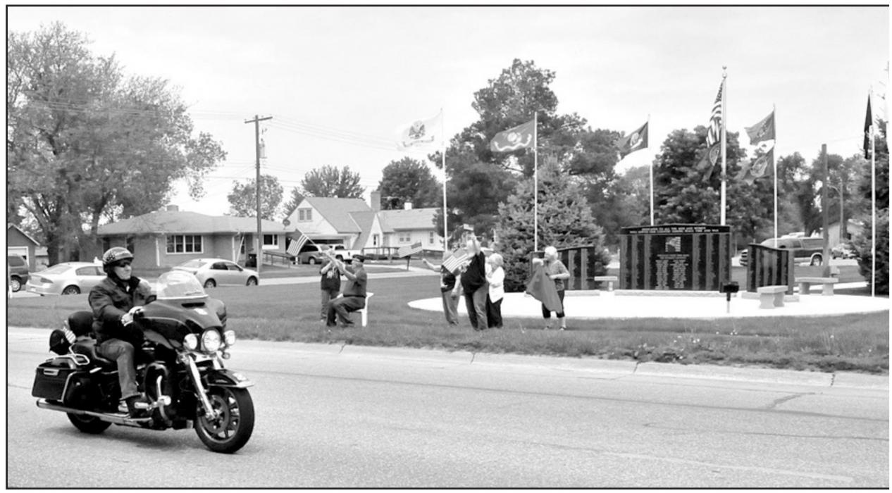 Community members show their support for the Medal of Honor riders as they pass the Veterans Memorial in front of the Brown County Courthouse. The Medal of Honor ride was held in honor of Nebraska’s 74 Medal of Honor Recipients.