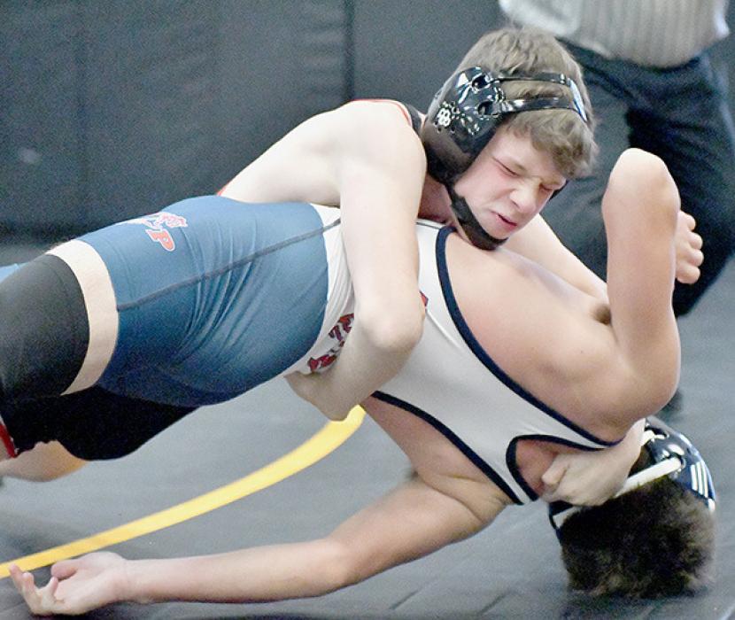 Dylan Titus placed third in the 132 lb. weight class at the Mullen Invitational. Titus won four of his five matches to take third place. Photos by Devin Painter