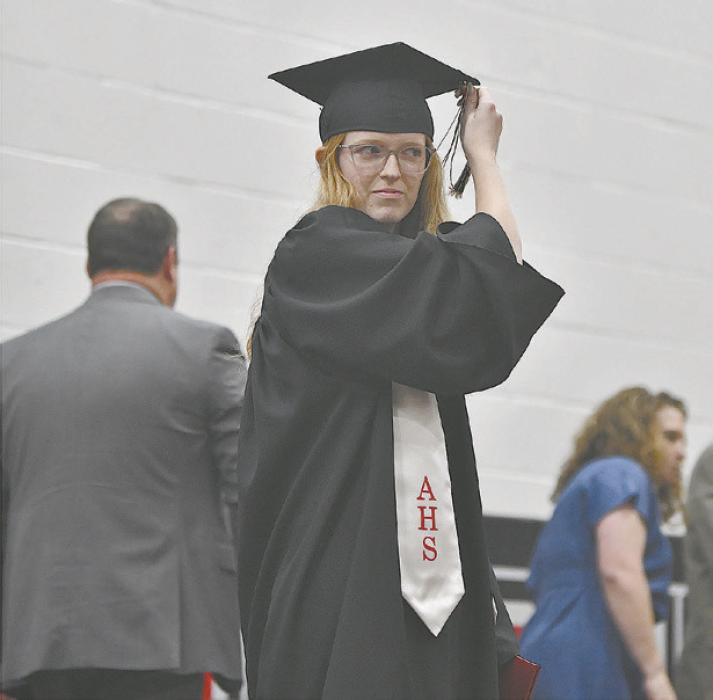 Terra Shoemaker turns her tassel as the last seniot to walk across the stage for her diploma.