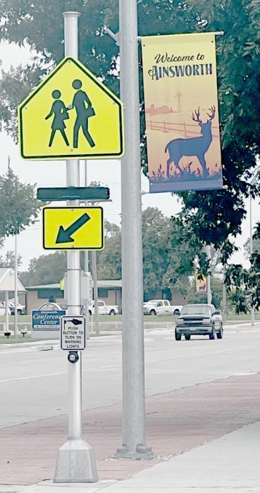 New crosswalk signs can be found along Highway 20 in Ainsworth this year. When you see these flashing lights, please be aware that a pedestrian is going to cross or is already in the crosswalk.