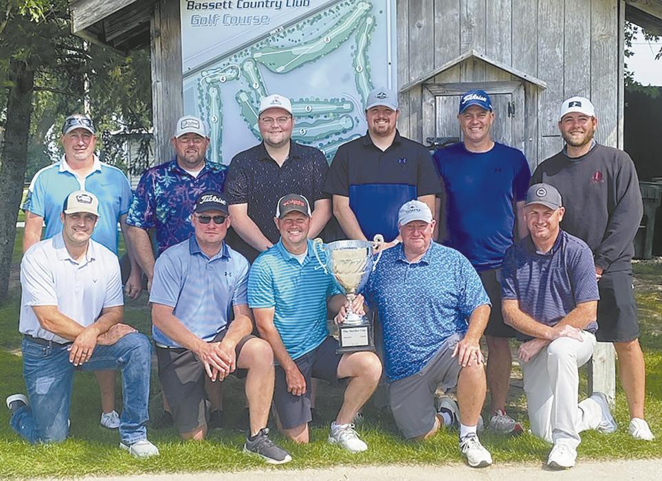 Bassett won the Border Cup Saturday, 13-12, over Ainsworth in the annual match play event. Winning team members are, front row left to right: Jacob Maurer, Jake Friedrich, Matt Morrison, Steve Camp and Brett Knoetzel. Back row: Bradd Bussinger, team captain Bryce Coleman, Eric Jaacks, John Klosterman, Brady Foster and Cordell Nilson.