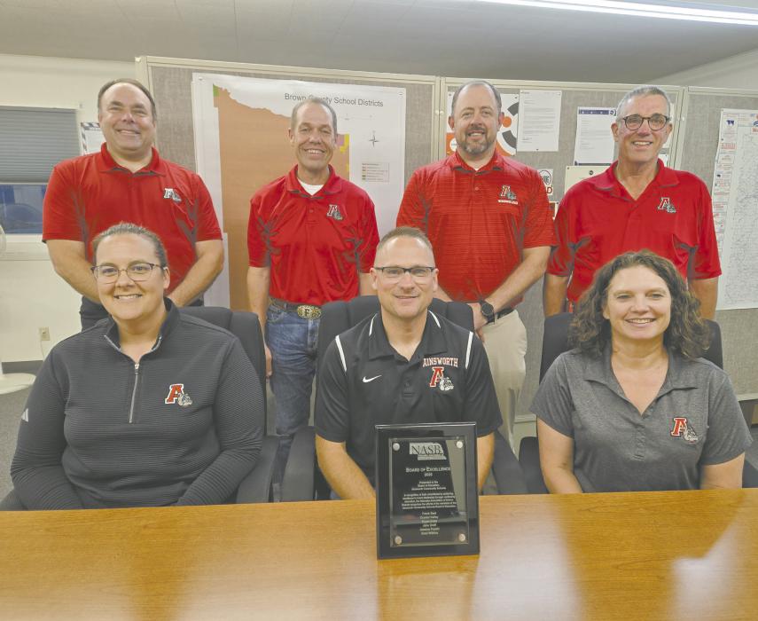 The Ainsworth School Board members are pictured above with their award plaque. Front row (left - right): Crystal Dailey, Bryan Doke, and Jessica Pozehl. Back row: Superintendent Dale Hafer, Frank Beel, Jake Graff, and Board President Brad Wilkins.