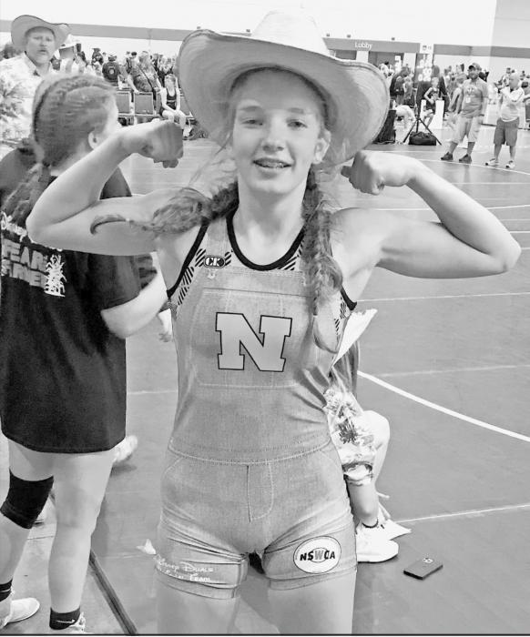 Jolyn Pozehl, incoming AHS freshman and Long Pine resident, recently traveled to Orlando for the 2021 AAU Scholastic Duals or the “Disney Duals” where she wrestled 7-5. Pozehl is pictured in a cowboy hat because she just won a match by pinning her opponent.