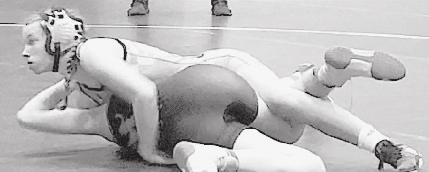 Pozehl, who wrestles in the 112 weight class, holds down her opponent for an eventual pin. Having advocated for the sanctioning of Girls High School Wrestling in Nebraska, Pozehl said the NSAA’s vote to sanction the sport in May was “great because more girls will go out for wrestling and it will actually be competitive.”