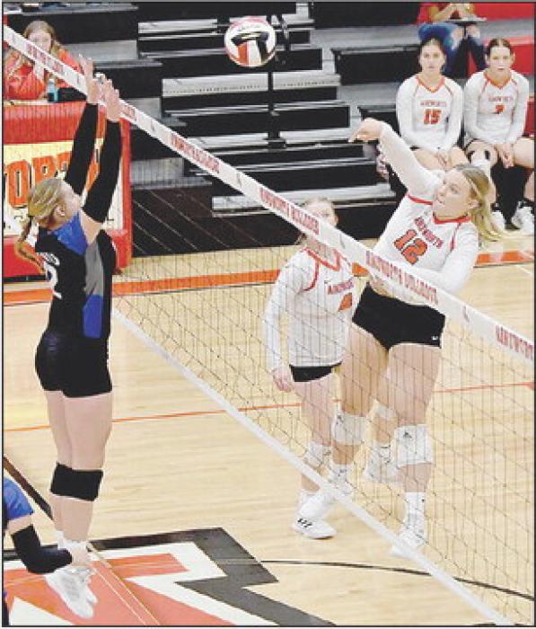 Jocelyn Good pounds the ball at a North Central Knight defender and gets one of her four kills.