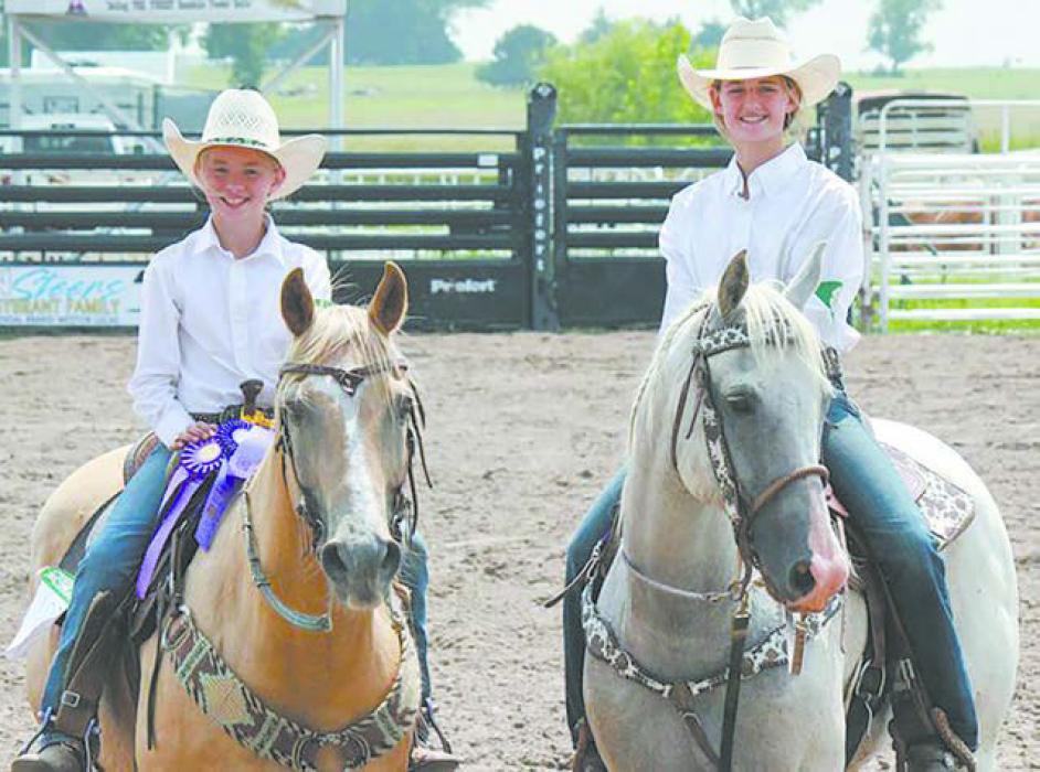 Ryli Harrington (Junior Horse) and Ariat Albrecht (Senior Horse) with their Champion Horses. Photo Courtesy of Hannah Keller