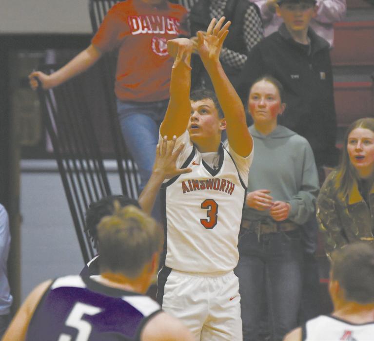 Zaine Evans shoots a three during the team’s game against Burwell. Evans had a career high 21 points against the Longhorns.