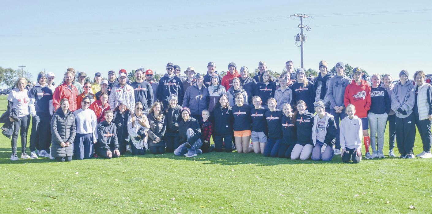 Jared Hansmeyer was surrounded by past athletes he coached during his career as a cross country and track and field coach. Many Ainsworth alumni attended the event.