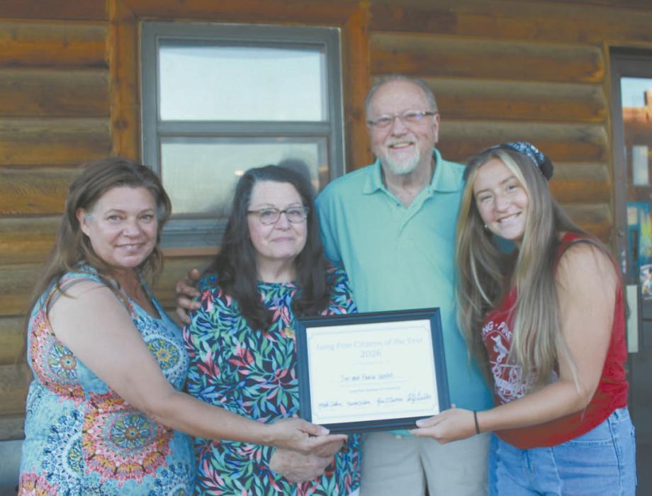 Jim and Paula Wilke were honored as the Long Pine Citizens of the year during Outlaw Days. Kelly and Dawson Deibler presented the couple with the award. The Long Pine Chamber of Commerce held its annual Long Pine Outlaw Days June 5-6. The community hosted several contests, karaoke, a cruise night, corgi and wiener dog races, duck races, a 5k race, silent auctions, and other activities. Photo Courtesy of Lindy Sanford