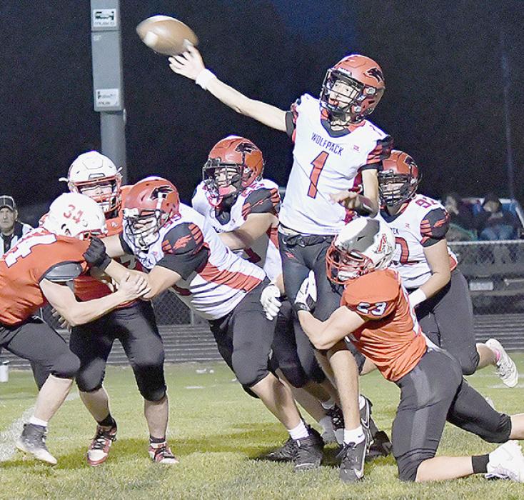 With Cole Swanson, #23, hanging on his leg, EPPJ’s Kellan Hoefer completed his only pass of the game.