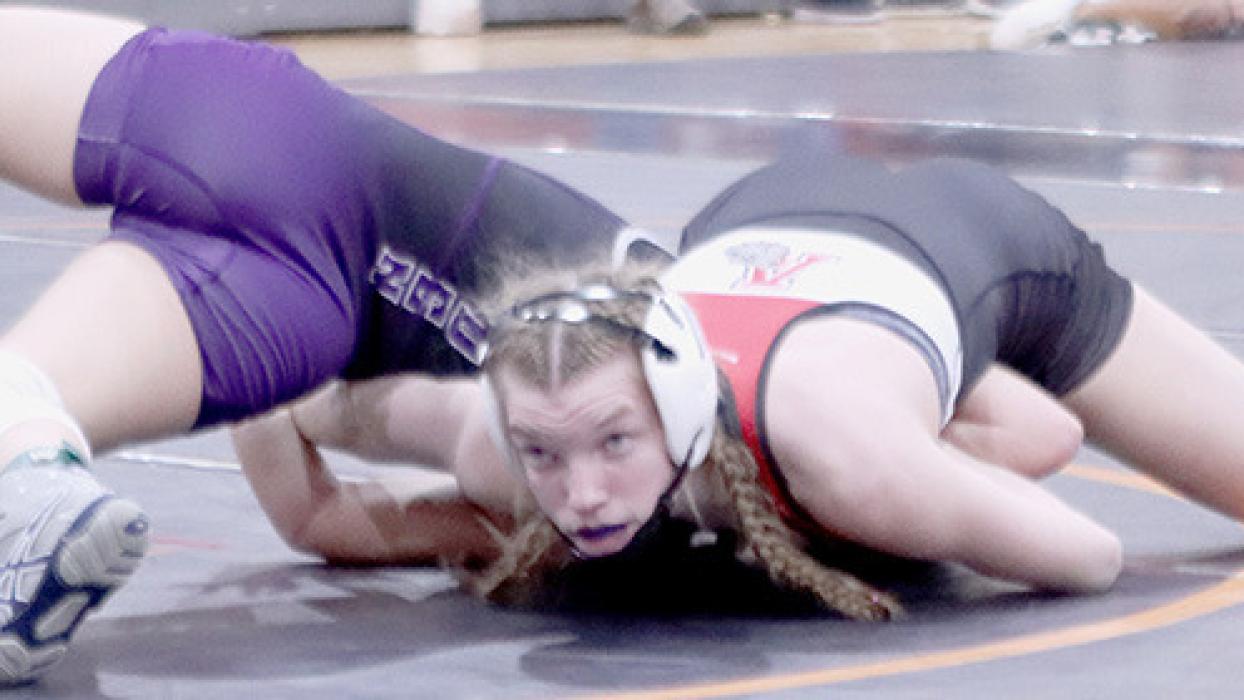 Jolyn Pozehl looks to the ref for the pin acknowledgment in one her matches on the way to a second place medal.