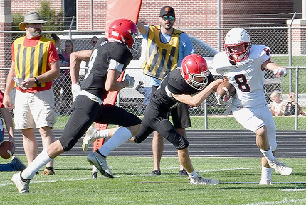 Logan Schroedl breaks a tackle and goes in for one of his two pass reception touchdowns in Friday’s shootout with St. Mary’s.