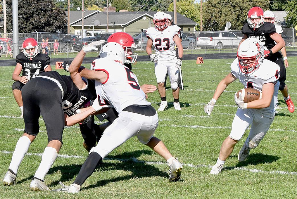 Owen Blumenstock, #5, blocks for Ryan Salzman, #4, to help set Ainsworth up for another touchdown against the St. Mary’s Cardinals.