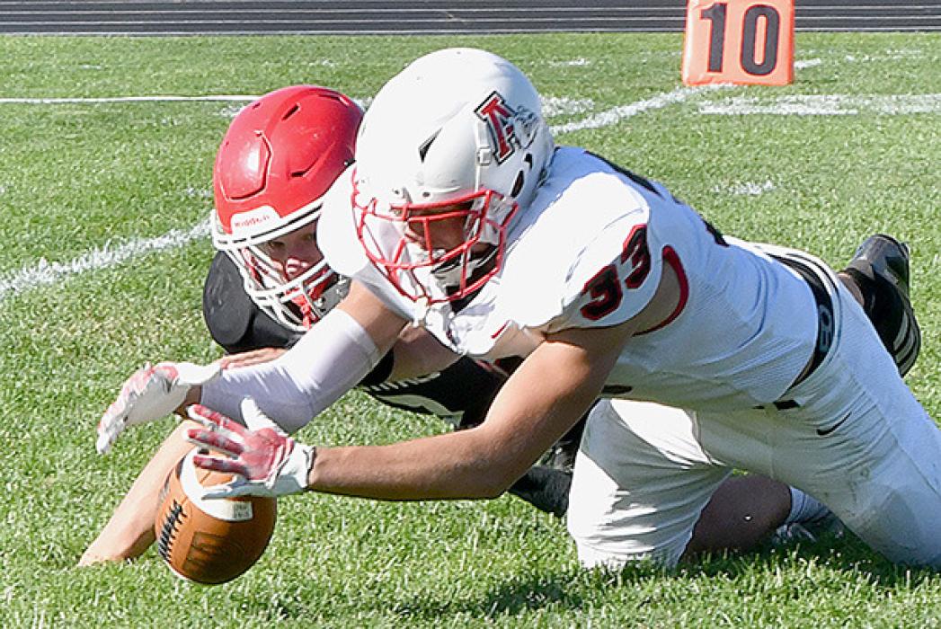 Aiden Jackman recovers a St. Mary’s fumble on Ainsworth’s 7-yard line and keeps the Cardinals from a potential touchdown.