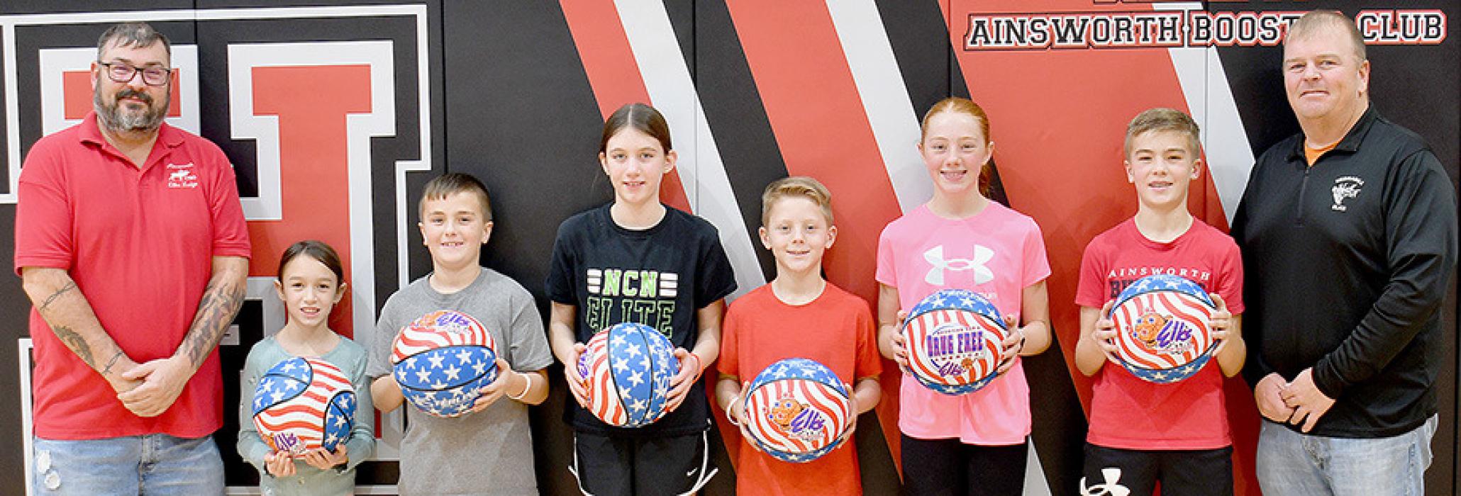 Exaulted Ruler Ben Beagle (Left) and Chairman of Trustees Sherm Goochey (Right) congratulate the six winners of the annual Elks Hoop Shoot Free Throw Contest held December 8th at McAndrew Gymnasium. Winners were (Left to Right) Cecilia Kerrigan, Jett Hansmeyer, Sutton Brodbeck, Landon Arens, Isabelle Arens and Blake Hansmeyer.