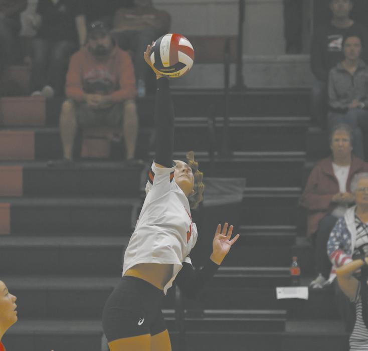 The team’s lone senior, Megan Jones, attacks the ball at a home match this season.