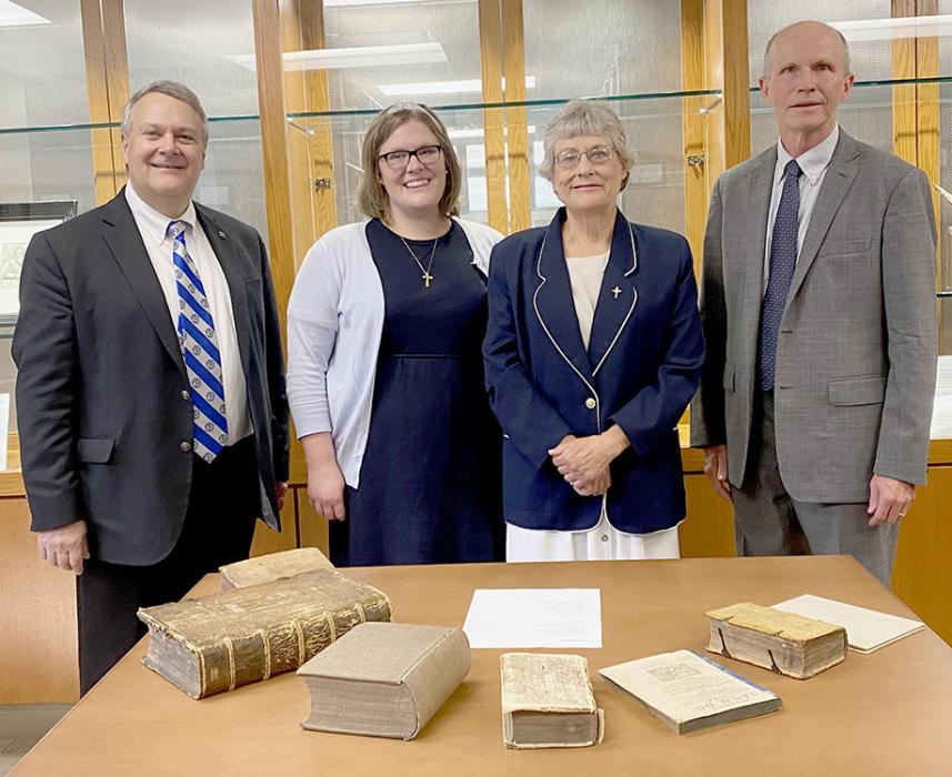 Seminary President Lawrence Rast received Georg Williams Collection of Rare Books from his daughter Rachel (Williams) Hollingsead and his wife, Georgia Williams, as Librarian Robert Roethmeyer was present for the donation.