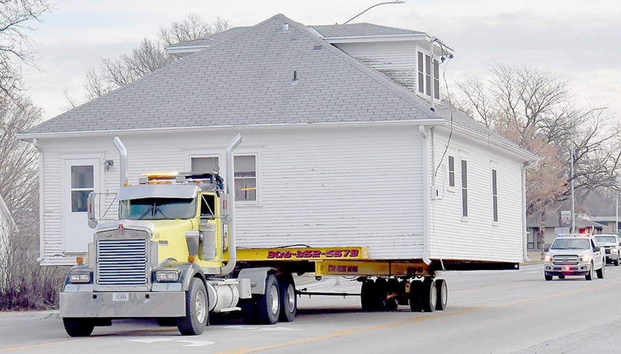 Star House Moving took the Coleman House down Higway 20 with a Brown County Sheriff's Office Deputy providing an escort. Traffic was stopped for a brief time while the movers turned the corner at North Oak Street and Highway 20.