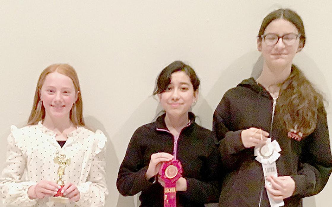 5th-8th Grade Spelling Bee winners: (Left to Right) 1st - Isabelle Arens, 2nd - Maya Villalobos, 3rd- Raelynn Reagan.