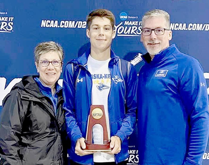 Ben Arens (center) proudly shows his NCAA All-American trophy he won at the 2023 National Championships in Pueblo, CO. His proud parents, Deana (left) and Jim (right) have enjoyed watching Ben run in the major events over his years in college to the very last one of his college career at nationals ending in 7th place.