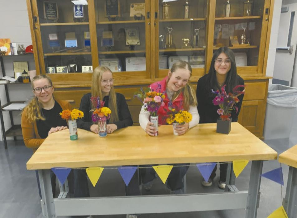 FFA members Lily Beel, Rowan Lemunyan, Kinsey Walz, and Annick Altimarano show off their “anything but a vase” floral design projects. Photo Courtesy of Josie Ganser, Ainsworth FFA Advisor