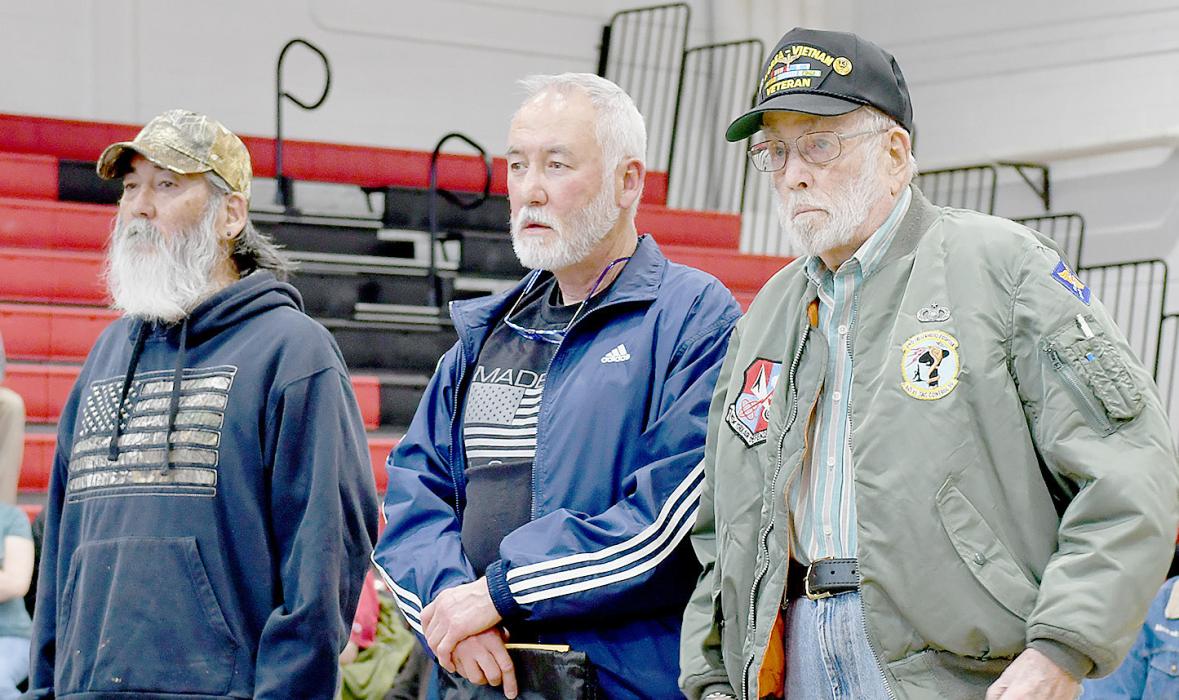 Three Veterans that stood up while their military branch anthem was played included (left to right): Military family members Al Lentz, Tony Lentz and Elmer Lentz. Each Veteran was presented a packet of items donated from businesses throughout the community showing support of their service.