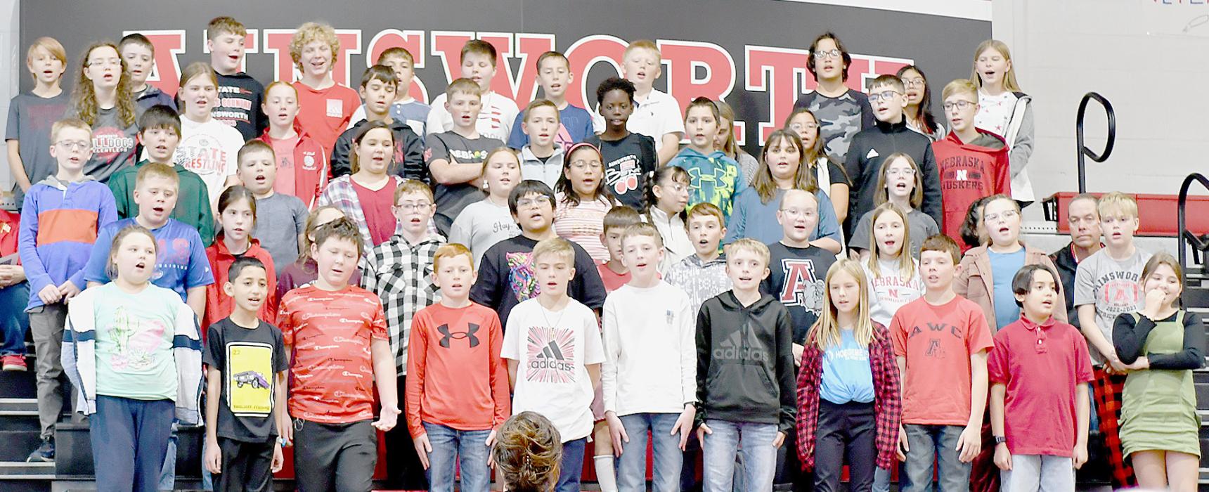 K-6 Choir sang “You’re a Grand Ole Flag”, Ainsworth High School Choir sang “Thank You, Soldiers”, and “A Tribute to the Armed Services.”