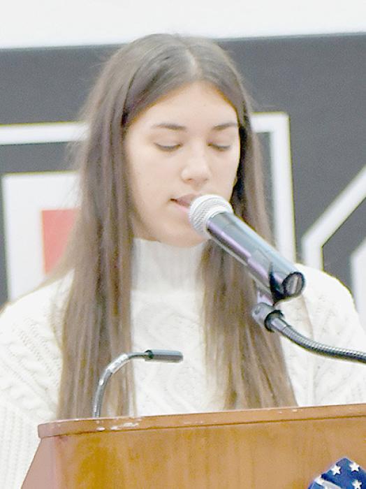 Katherine Kerrigan, the 2023 Cornhusker Girls State Delegate read the poem “In Flanders Fields” by John McCrae.