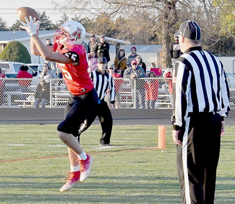 Trey Appelt catches a pass in the end zone for a touchdown to cut into Elm Creek’s lead.