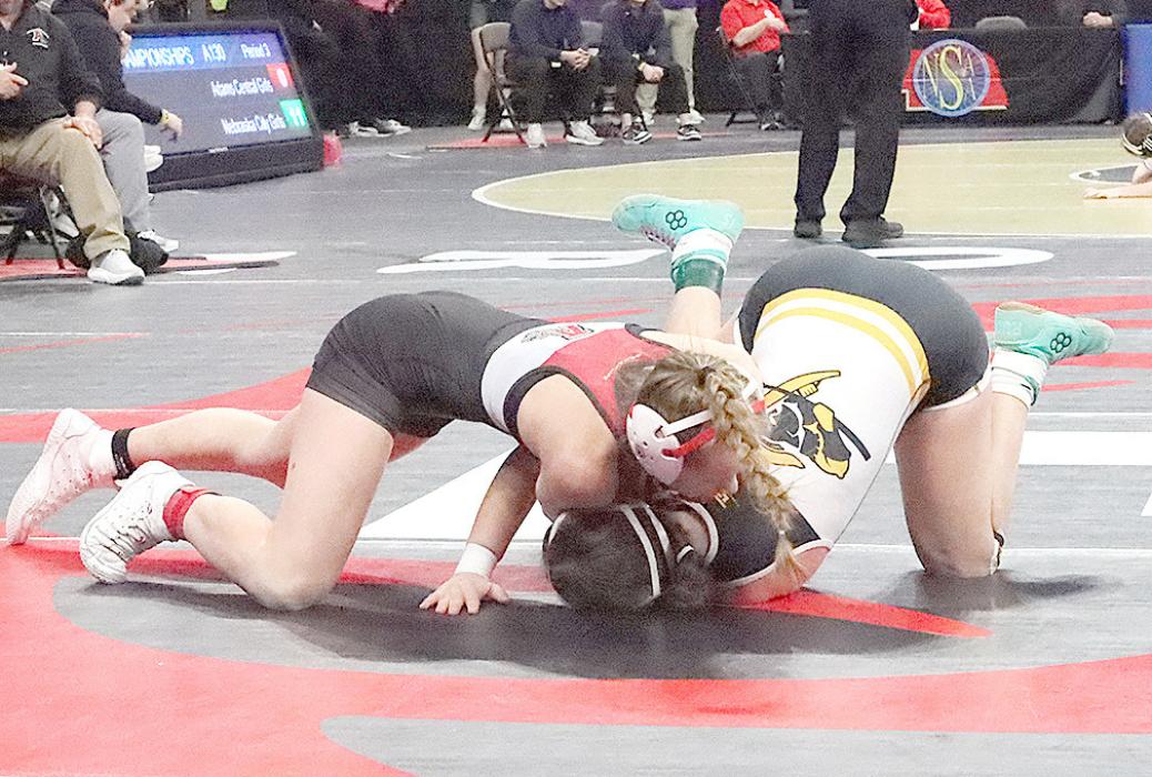 Megan Jones pushes to turn her opponent over in her match against Jaycee Vogel of Ansley-Litchfield.