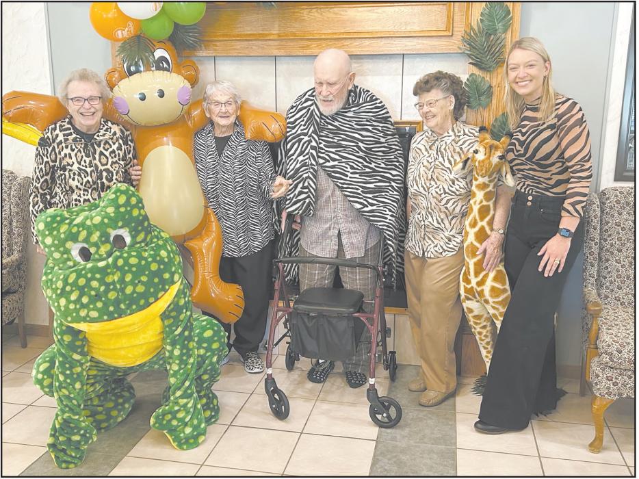 Staff and several residents dressed in animal patterns during 'Wild Wednesday.