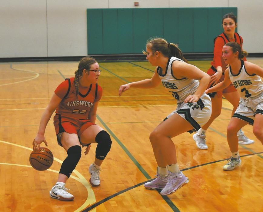 Gracyn Painter dribbles behind her back in her final game of the season.