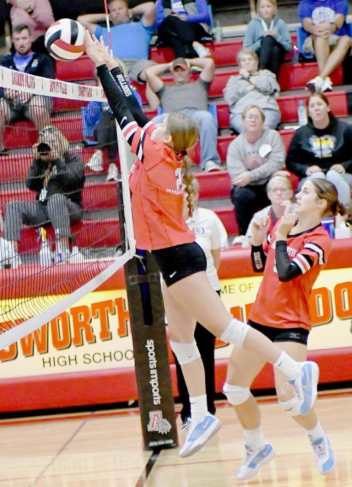 Jaylee Good sends the volleyball over to the Eagles. Teammate Willa Flynn is ready to assist in case the ball came back.