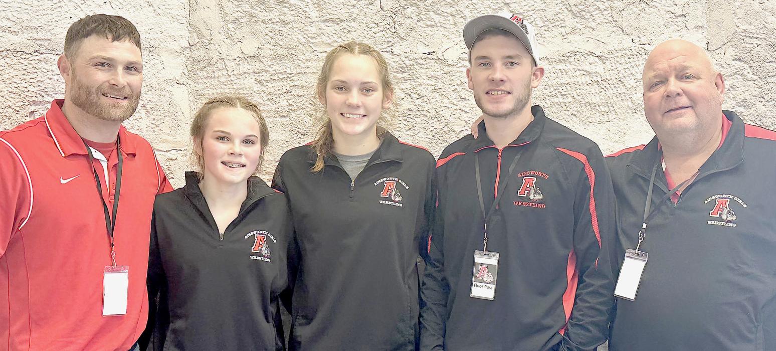 Ainsworth High School State Girls Wrestling Qualifiers, Paisley Hoffman and Megan Jones who will be competing in the 2025 NSAA Girls Wrestling Tournament. Coaches this year are (Left to Right) Ryan Hoffman, Oren Pozehl and Todd Pollock.