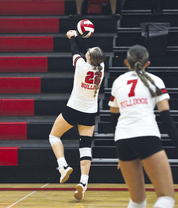 Junior Gracyn Painter chases a ball down across the court.