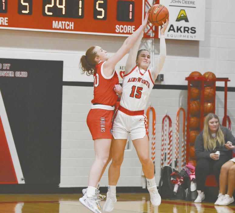 Willa Flynn fights to hold onto the ball during the team’s game against Broken Bow.