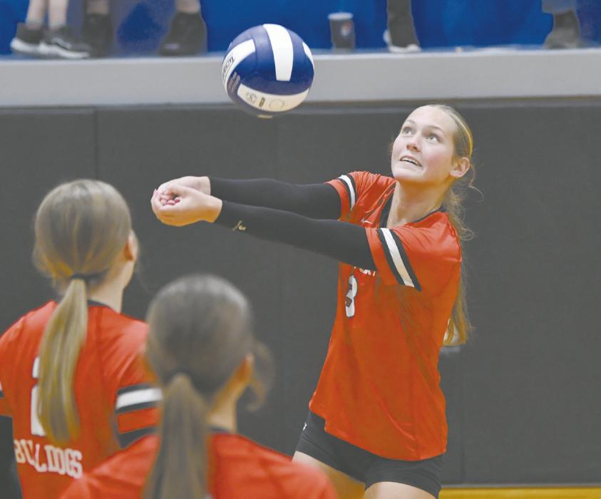 Senior Megan Jones digs a ball during the team’s game against North Central.