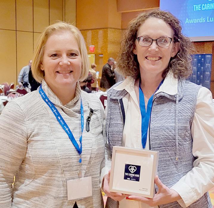Brown County Hospital Chief Executive Officer Mirya Hallock stands with this year’s recipient of the Caring Kind Award winner, Sasha Taylor.