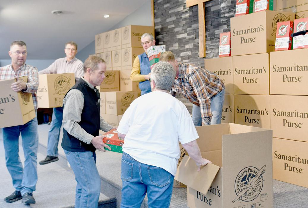 Members of the E Free Church carried all the boxes out to the trailer so they could be taken to their next destination in Denver, CO where they will be flown out. Each big box holds 15 small boxes.