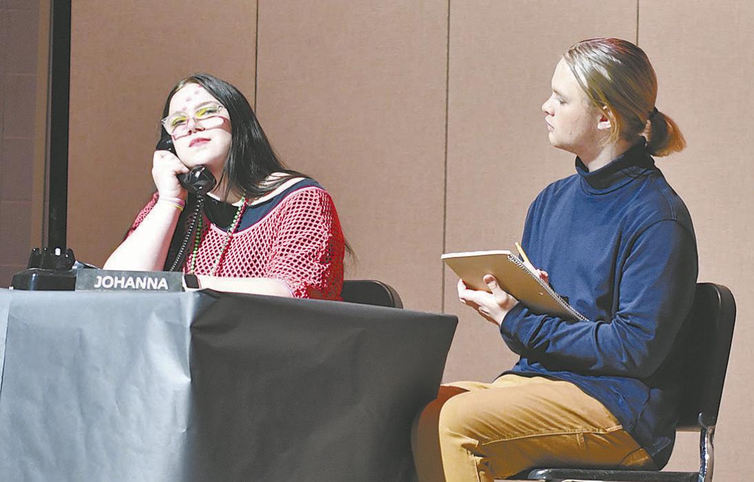 Sophomores Miranda Phares and Erick Hitchcock answer the Powerline, a hot-line that helps video game enthusiasts work through their issues.