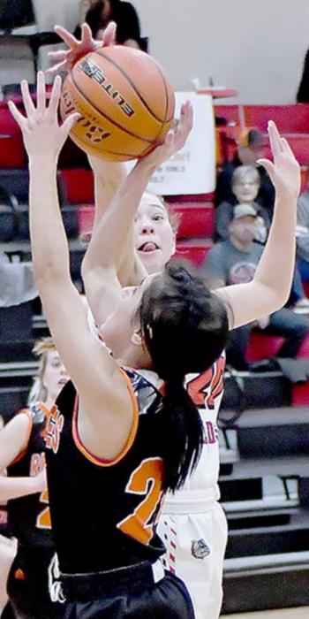 Bria Delimont gets her hand on the ball to stop a shot in Ainsworth’s win over CWC.