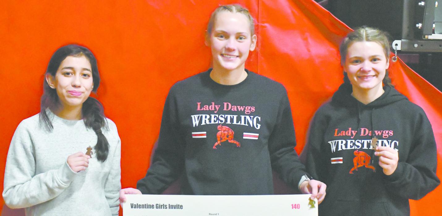 From left to right: Maya Macias, Megan Jones, and Makenna Koch each earned a medal during the Valentine Girls Wrestling Invite.
