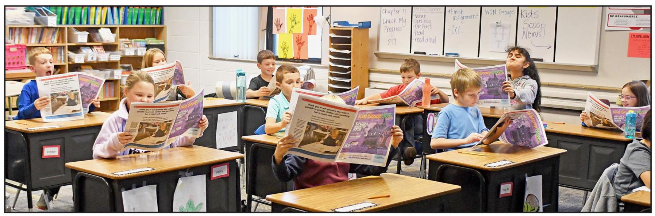 Third through fifth graders at Ainsworth Community Schools are receiving kid-friendly print newspapers called Kid Scoop News delivered each month of the school year by the Ainsworth Star-Journal in partnership with the Nebraska Press Association Foundation. Above, Mrs. Fairhead’s third grade class enjoys reading their own personal newspapers.