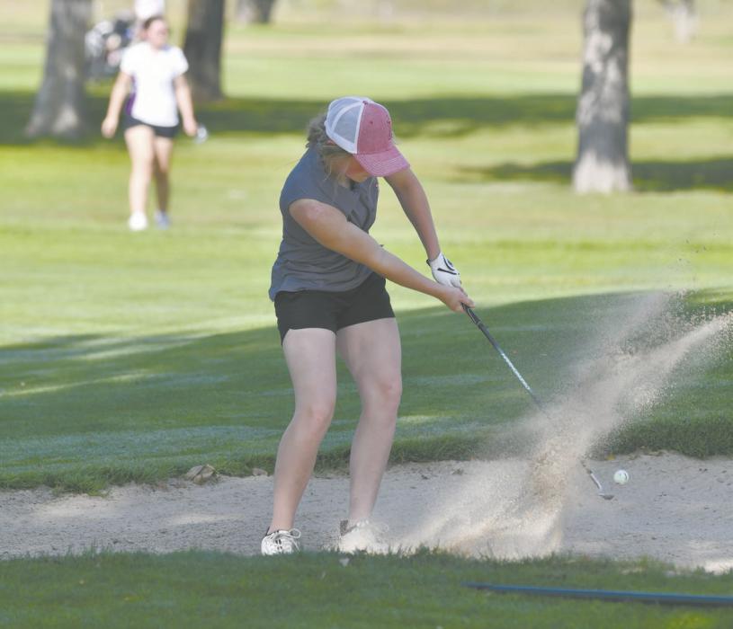 Junior Kinley Welke chips out of the sand trap. Welke placed 18th at the Bulldogs’ home invite.