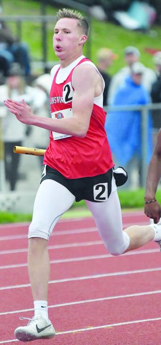 Jacob Ortner runs his leg of the 4x400 meter relay at the State Meet last May.