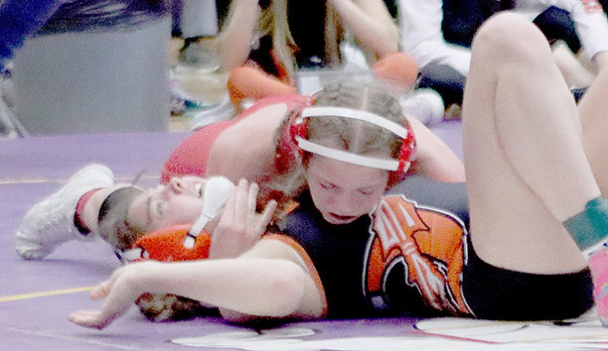 Megan Jones defeated Lake McClure of Ogallala in the 140 lb. weight class on the way punching her ticket to the State Wrestling Tournament. Photos by Jessica Pozehl