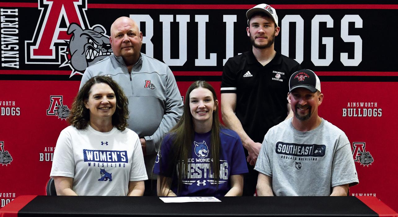 Celebrating Jolyn’s signing were (Back Row Left-Right): Coaches Todd Pollock and Oren Pozehl, (Front Row Left-Right): Mother Jessica Pozehl, Jolyn, and Father Matt Pozehl.
