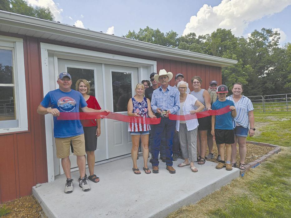 Photo Courtesy of Kathleen Neidig Board members and supporters cut the ribbon during the grand opening of the Meadville Cultural and Historical Museum on July 5. Pictured above cutting the ribbon is Rodney Palmer.