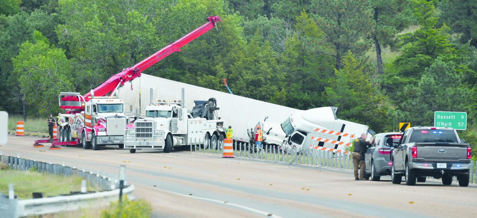 Pictured above is the clean up efforts of several entities removing the truck and trailer on Wednesday, September 17.